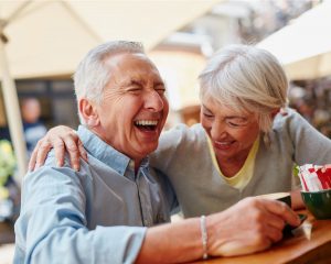 a senior couple laughing
