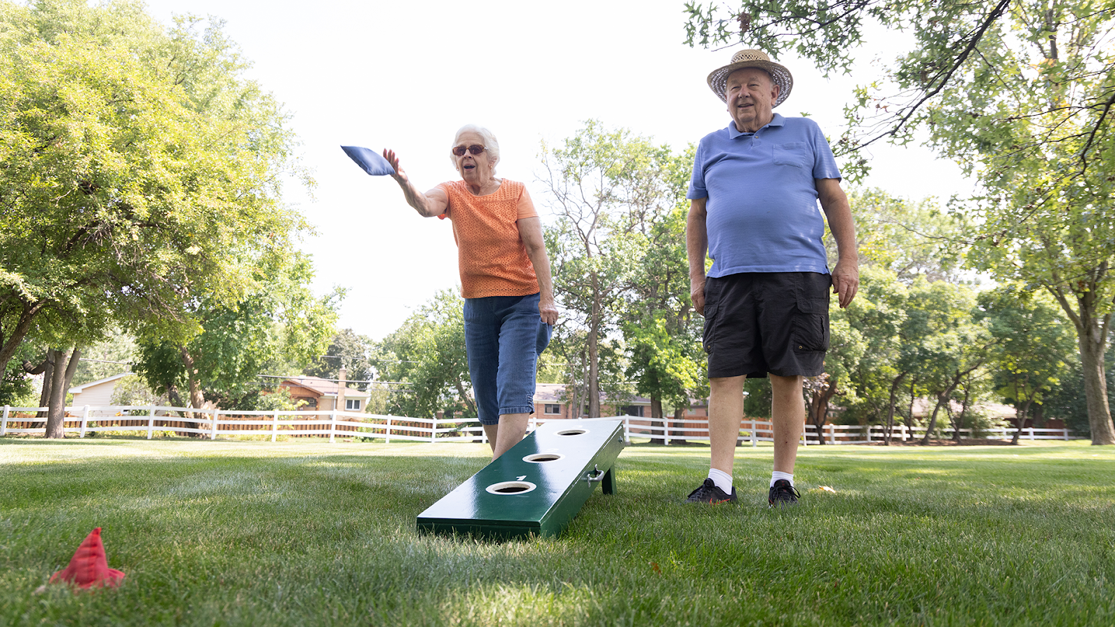 Residents plaaying Corn Hole at The Moorings of Arlington Heights