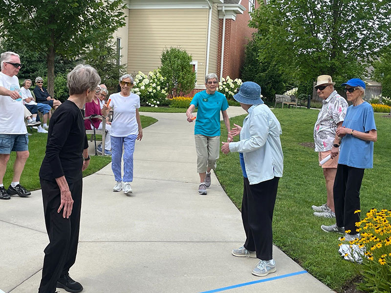 Residents of The Moorings of Arlington Heights participating in a walk race event.
