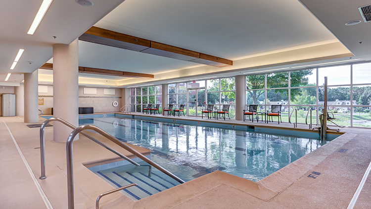 an indoor swimming pool at a senior living community